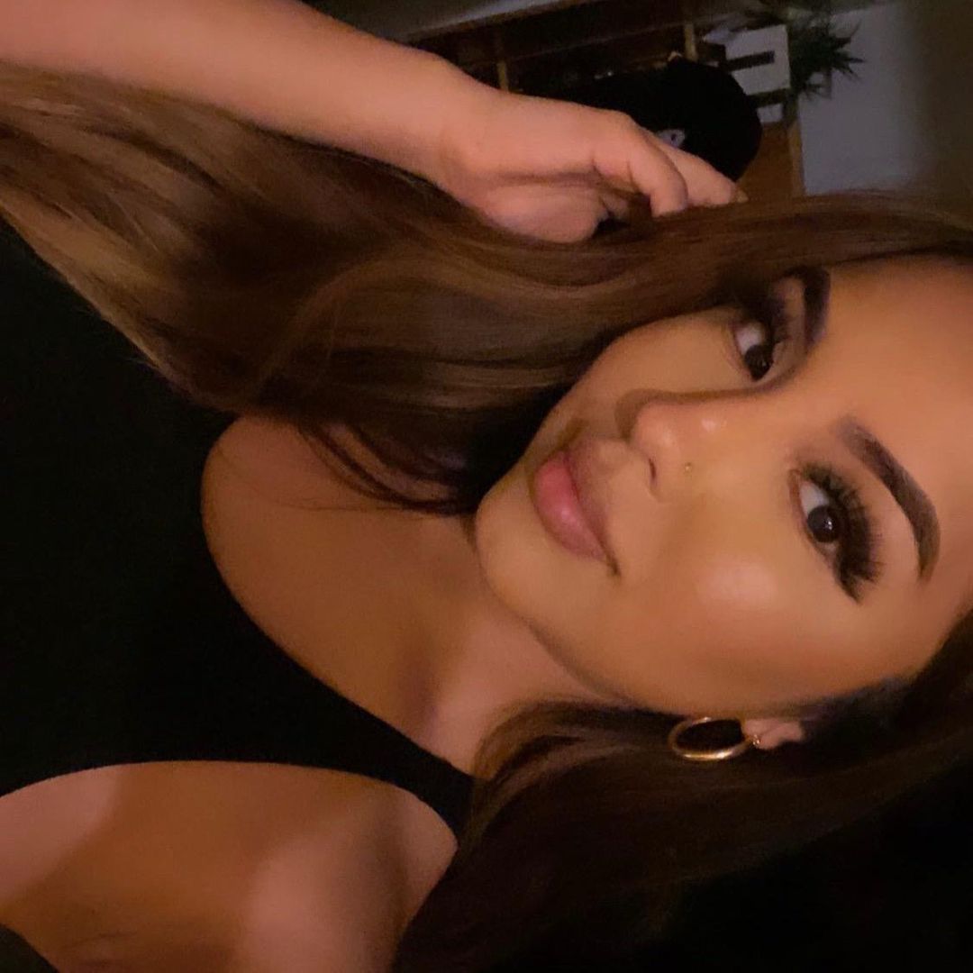 T.