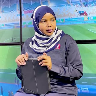 TUNU HASSAN SHENKOME